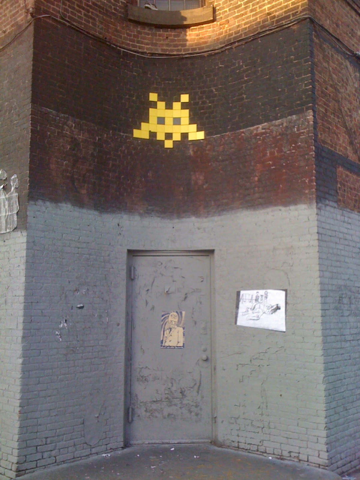 An "invader" from Space Invaders on a wall. 