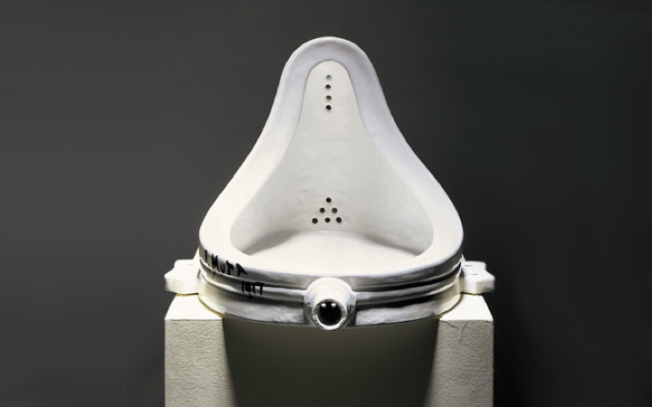 A urinal on a pedastal. "R Mutt 1947" written on the bottom left. 