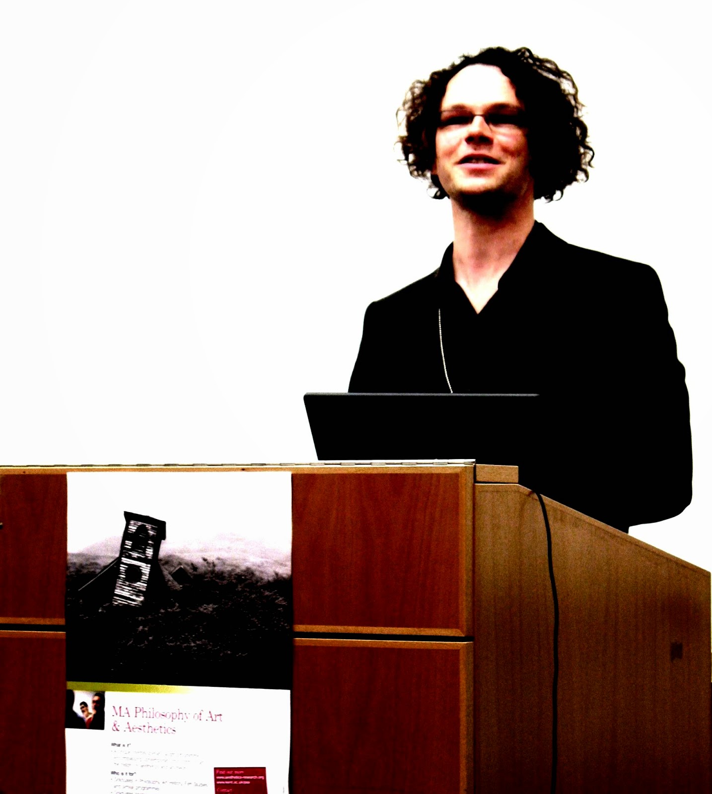 Photograph of Hans Maes at a podium