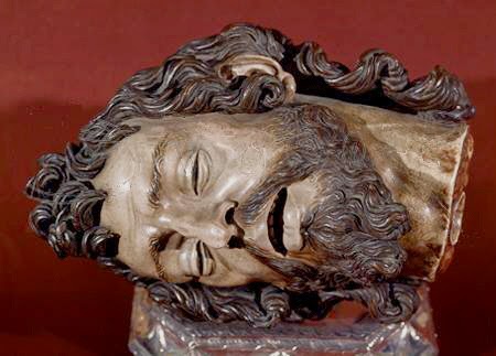 Sculpture of decapitated head. 