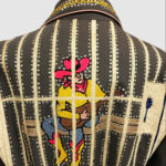 A black bedazzled jacket. Vertical and lines going up and down the entire back form bars on a jail cell beyond which a lonely cowboy plays a guitar.