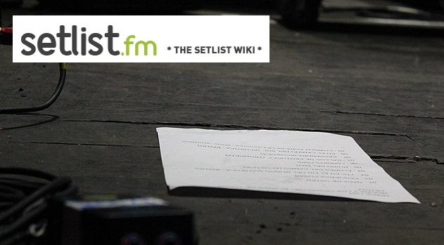 The Setlist.fm banner image, containing the website's wordmark, set against a close-up photograph of a band's printed setlist lying directly on a wooden stage